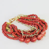 Make a chunky bracelet  with beads and chains.