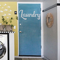 Laundry room reveal - clothes pin art and chalk board door