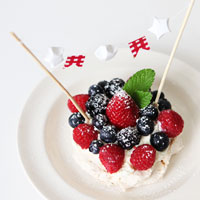 Pavlova with cream and berries