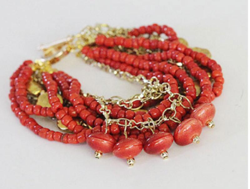 Make a chunky bracelet with beads and chains.