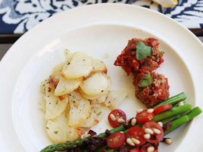Fresh herb lentil quinoa balls in tomato sauce, potato torte and asparagus side - gluten and dairy free